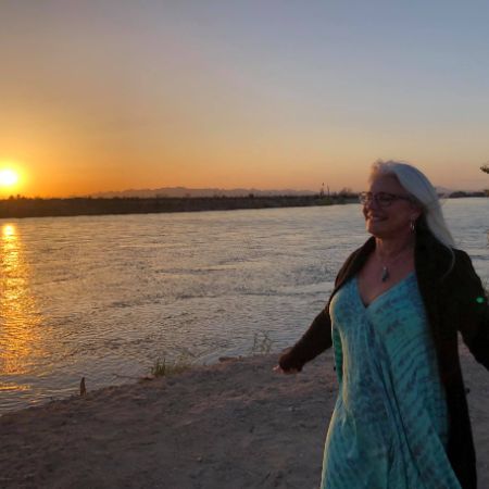 Chimene Diaz posed for a picture near a body of water.